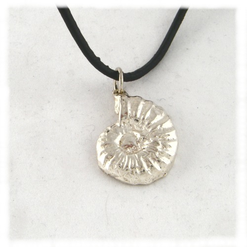 Half thickness silver cast of ammonite